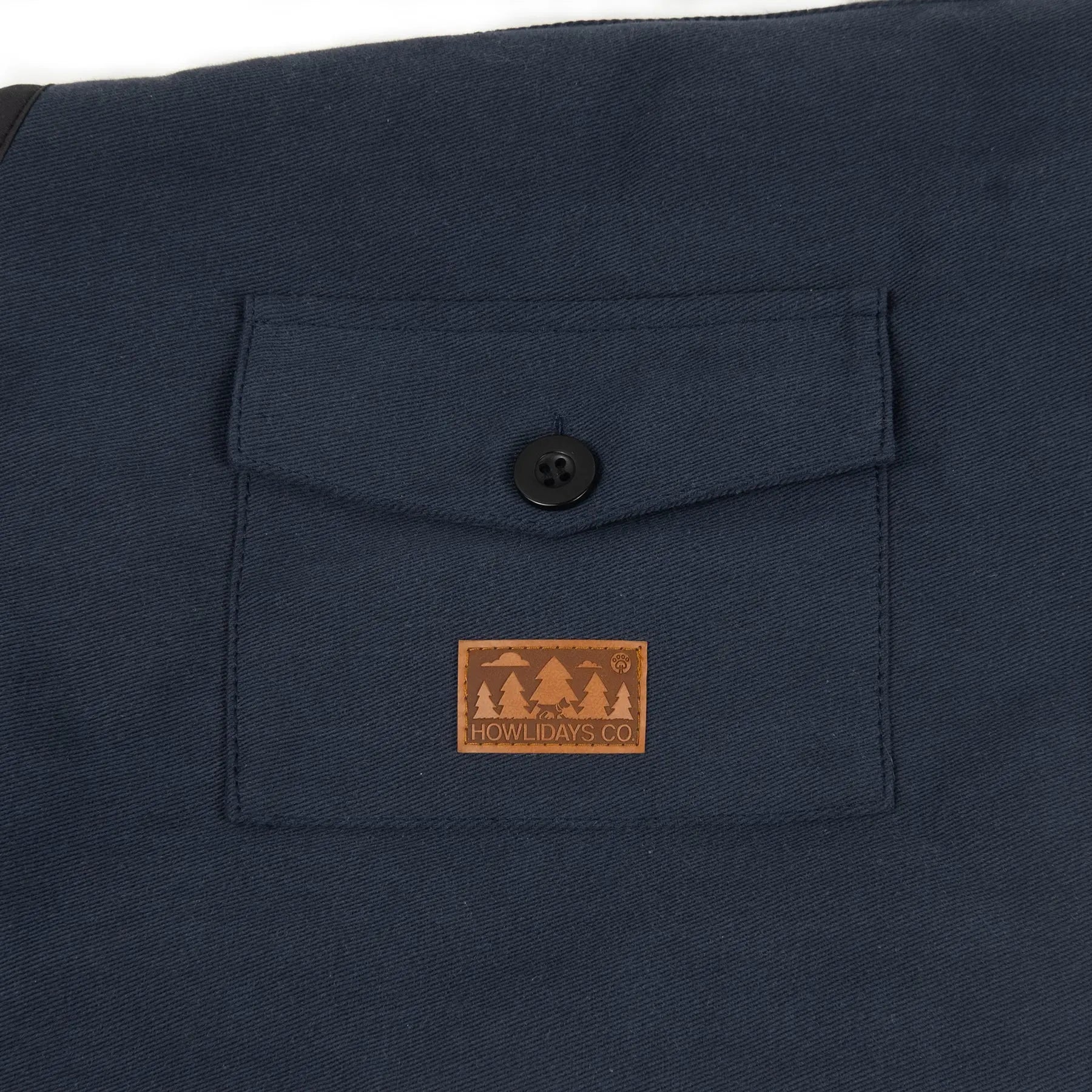 Close-up of a functional pocket on a winter dog coat, ideal for small essentials like treats or waste bags.