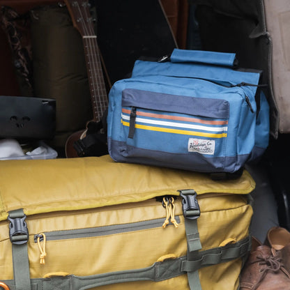 Rad to the Bone Dog Adventure Backpack shown inside a vehicle for a road trip.